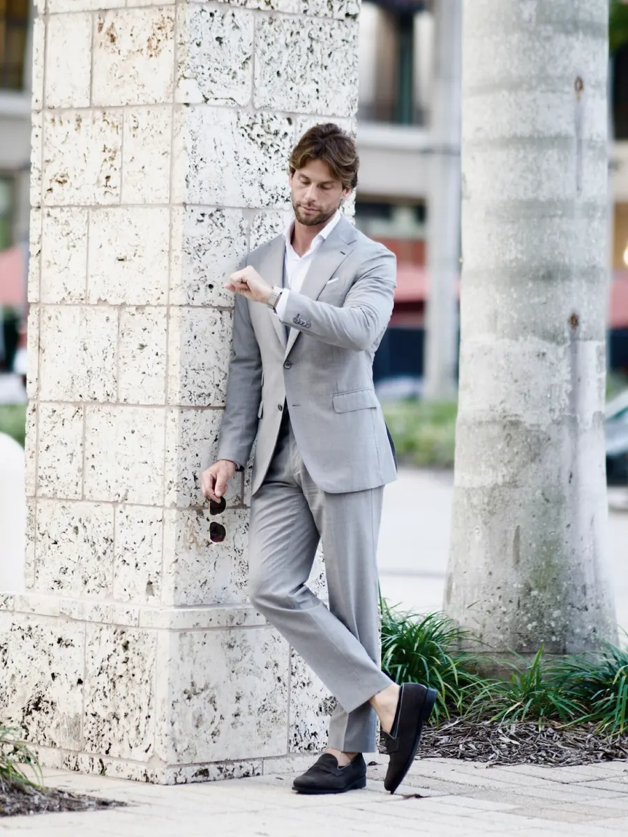 Against the coral stone, cigar in hand
