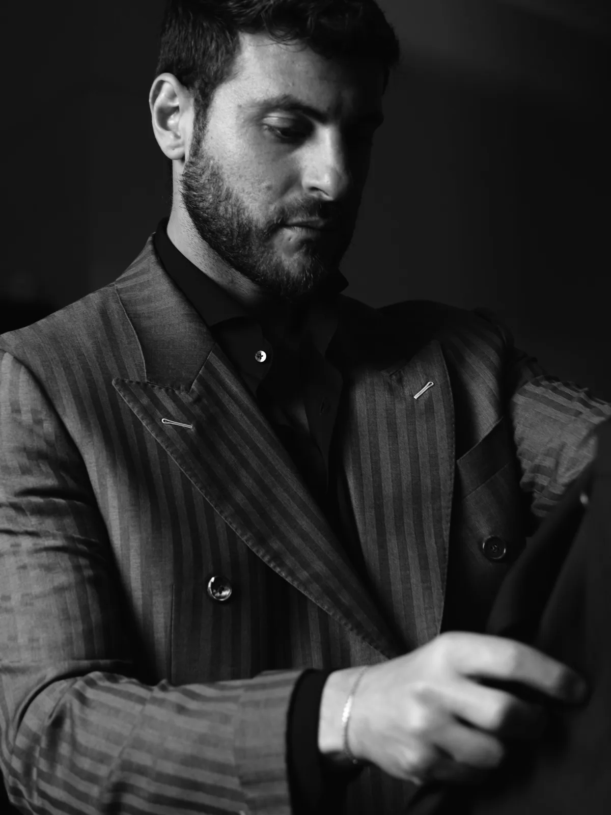 Grey pinstripe suit, adjusted by hand in the showroom